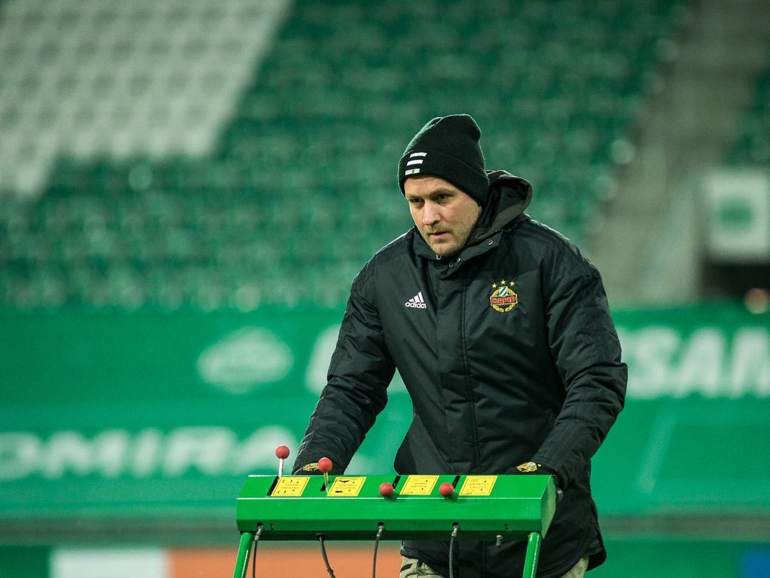 Daniel Heckl from Rapid Wien mowing the grass